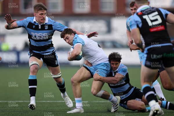 260322 - Cardiff Rugby v Glasgow Warriors - United Rugby Championship - Jamie Bhatti of Glasgow is tackled by Lloyd Williams of Cardiff Rugby