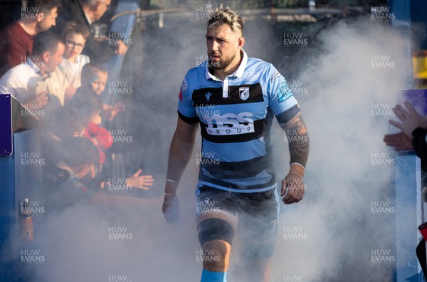 260322 - Cardiff Rugby v Glasgow Warriors, United Rugby Championship - Josh Turnbull of Cardiff Rugby leads the team out through the smoke