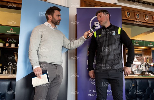 260322 - Cardiff Rugby v Glasgow Warriors, United Rugby Championship - Rhys Priestland talks with Nicky Robinson in hospitality ahead of the match