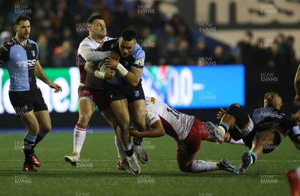 130124 - Cardiff Rugby v Harlequins - Investec Champions Cup - Willis Halaholo of Cardiff is tackled by Danny Care and Marcus Smith of Harlequins 