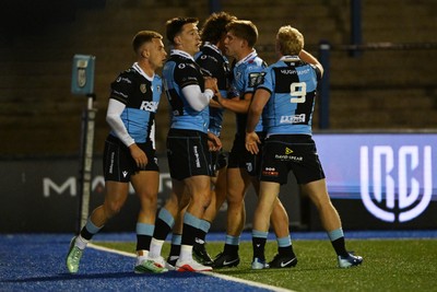 231026 - Cardiff Rugby v Hollywoodbets Sharks - United Rugby Championship - Josh Adams of Cardiff Rugby celebrates scoring a try with team mates