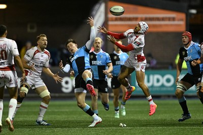 231026 - Cardiff Rugby v Hollywoodbets Sharks - United Rugby Championship - Josh Adams of Cardiff Rugby is challenged by Edwill van der Merwe of Sharks