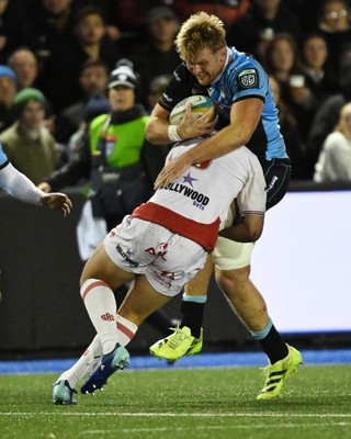 231026 - Cardiff Rugby v Hollywoodbets Sharks - United Rugby Championship - Josh McNally of Cardiff Rugby is challenged by Jason Jenkins of Sharks