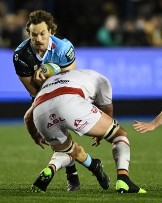 231026 - Cardiff Rugby v Hollywoodbets Sharks - United Rugby Championship - Le Roux Malan of Cardiff Rugby is challenged by Jason Jenkins of Sharks