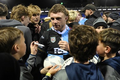 231026 - Cardiff Rugby v Hollywoodbets Sharks - United Rugby Championship - Tom Bowen of Cardiff Rugby with fans