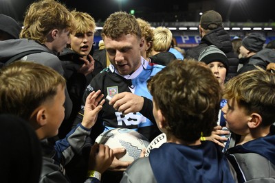 231026 - Cardiff Rugby v Hollywoodbets Sharks - United Rugby Championship - Tom Bowen of Cardiff Rugby with fans