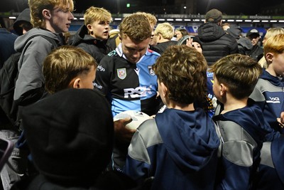 231026 - Cardiff Rugby v Hollywoodbets Sharks - United Rugby Championship - Tom Bowen of Cardiff Rugby with fans