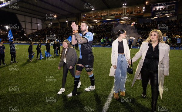 020324 - Cardiff Rugby v Leinster, United Rugby Championship - Josh Turnbull of Cardiff Rugby leads the team out with his family at the start of the match for his 200th Cardiff cap
