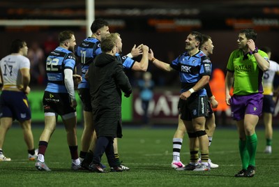 270226 - Cardiff v Leinster - United Rugby Championship - Mason Grady, Johan Mulder and Harri Millard of Cardiff celebrate at full time