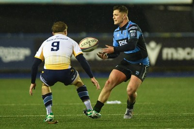 270226 - Cardiff Rugby v Leinster - United Rugby Championship - Callum Sheedy of Cardiff Rugby is challenged by Fintan Gunne of Leinster