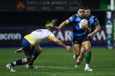 270226 - Cardiff Rugby v Leinster - United Rugby Championship - Ben Thomas of Cardiff Rugby is challenged by Max Deegan of Leinster