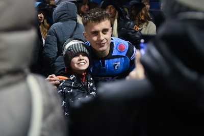 270226 - Cardiff Rugby v Leinster - United Rugby Championship - Cam Winnett of Cardiff Rugby with fans at full time