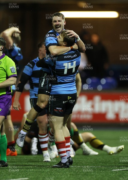 270226 - Cardiff v Leinster - United Rugby Championship - Jacob Beetham and Harri Millard of Cardiff celebrate at full time