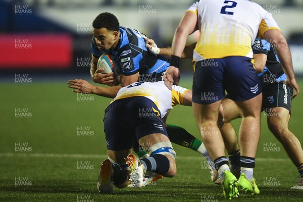 270226 - Cardiff Rugby v Leinster - United Rugby Championship - Ben Thomas of Cardiff Rugby is challenged by Andrew Sparrow of Leinster