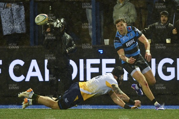 270226 - Cardiff Rugby v Leinster - United Rugby Championship - Mason Grady of Cardiff Rugby is challenged by Fintan Gunne of Leinster