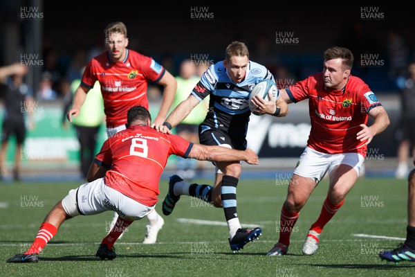 170922 - Cardiff Rugby v Munster - United Rugby Championship - Liam Williams of Cardiff Rugby is tackled by Jack O’Sullivan of Munster