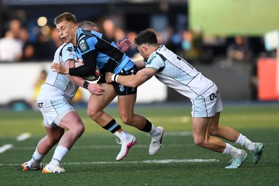 240426 - Cardiff Rugby v Ospreys - United Rugby Championship - Cam Winnett of Cardiff Rugby is challenged by Luke Morgan of Ospreys