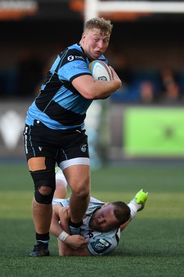 240426 - Cardiff Rugby v Ospreys - United Rugby Championship - Rhys Barratt of Cardiff Rugby is challenged by Steffan Thomas of Ospreys