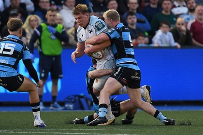 240426 - Cardiff Rugby v Ospreys - United Rugby Championship - Jac Morgan of Ospreys is challenged by Johan Mulder of Cardiff Rugby