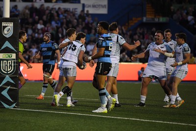 240426 - Cardiff Rugby v Ospreys - United Rugby Championship - Jack Walsh of Ospreys celebrates scoring a try with team mates