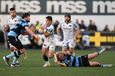 240426 - Cardiff Rugby v Ospreys - United Rugby Championship - Jack Walsh of Ospreys is challenged by Rory Thornton of Cardiff Rugby