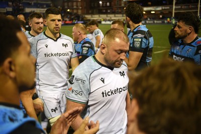 240426 - Cardiff Rugby v Ospreys - United Rugby Championship - Dejected Ospreys players at full time