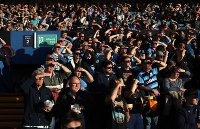 240426 - Cardiff Rugby v Ospreys - United Rugby Championship - Fans watch the game in the sun