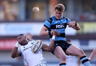 240426 - Cardiff Rugby v Ospreys - United Rugby Championship - Dan Kasende of Ospreys collides with Jacob Beetham of Cardiff Rugby