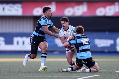 240426 - Cardiff Rugby v Ospreys - United Rugby Championship - Jack Walsh of Ospreys is tackled by Rory Jennings of Cardiff Rugby
