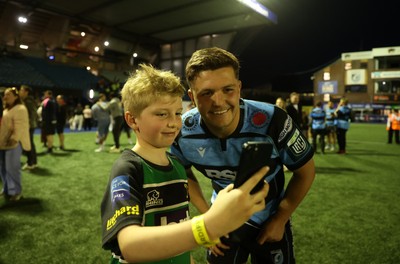 240426 - Cardiff Rugby v Ospreys - United Rugby Championship - Callum Sheedy of Cardiff Rugby with fans at full time