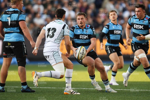 240426 - Cardiff Rugby v Ospreys - United Rugby Championship - Daf Huughes of Cardiff Rugby is challenged by Owen Watkin of Ospreys