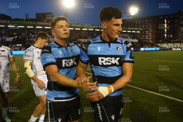 240426 - Cardiff Rugby v Ospreys - United Rugby Championship - Callum Sheedy of Cardiff Rugby and Ellis Bevan of Cardiff Rugby at full time