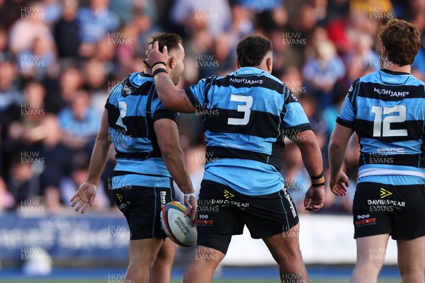 240426 - Cardiff Rugby v Ospreys - United Rugby Championship - Liam Belcher of Cardiff Rugby celebrates scoring a try with team mates
