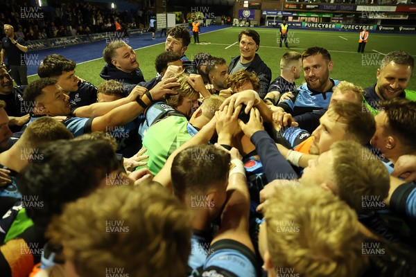 240426 - Cardiff Rugby v Ospreys - United Rugby Championship - Cardiff team huddle at full time