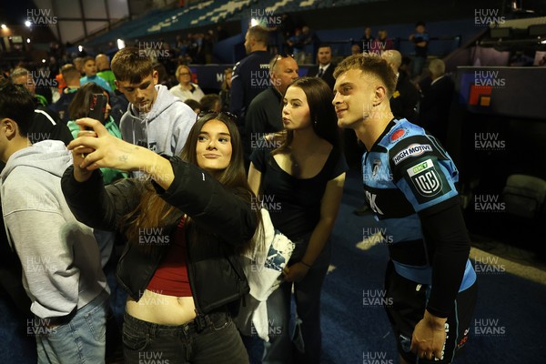 240426 - Cardiff Rugby v Ospreys - United Rugby Championship - Cam Winnett of Cardiff Rugby with fans at full time