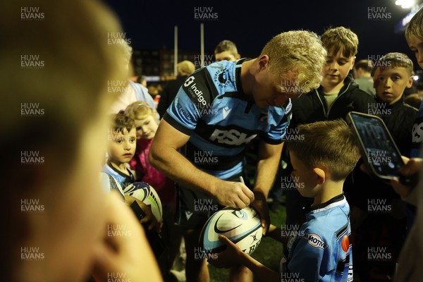 240426 - Cardiff Rugby v Ospreys - United Rugby Championship - Rory Jennings of Cardiff Rugby with fans at full time