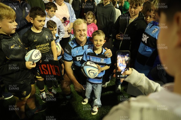 240426 - Cardiff Rugby v Ospreys - United Rugby Championship - Rory Jennings of Cardiff Rugby with fans at full time