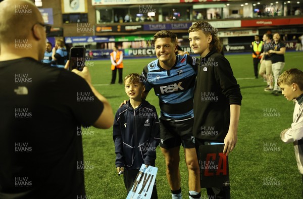 240426 - Cardiff Rugby v Ospreys - United Rugby Championship - Callum Sheedy of Cardiff Rugby with fans at full time
