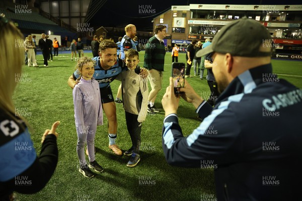 240426 - Cardiff Rugby v Ospreys - United Rugby Championship - Callum Sheedy of Cardiff Rugby with fans at full time