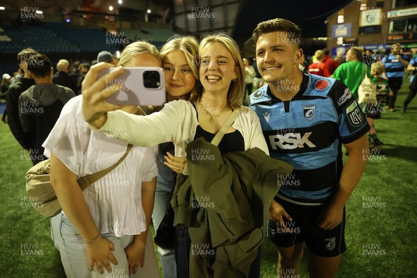 240426 - Cardiff Rugby v Ospreys - United Rugby Championship - Callum Sheedy of Cardiff Rugby with fans at full time