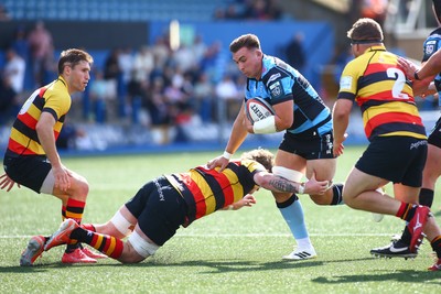 060925 - Cardiff Rugby v Richmond - Preseason Friendly - Taine Basham of Cardiff is tackled by Donnacha Byrne of Richmond