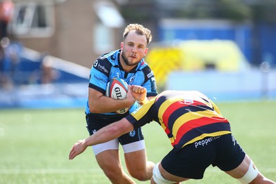 060925 - Cardiff Rugby v Richmond - Preseason Friendly - Ioan Lloyd of Cardiff is tackled by Jared Cardew of Richmond