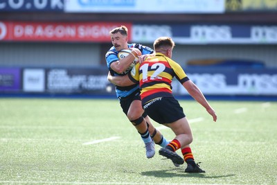060925 - Cardiff Rugby v Richmond - Preseason Friendly - Harri Millard of Cardiff is tackled by Ronnie Du Randt of Richmond