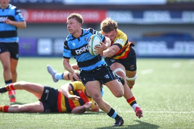 060925 - Cardiff Rugby v Richmond - Preseason Friendly - Tom Bowen of Cardiff takes on Jared Cardew of Richmond