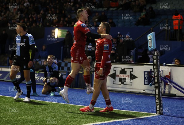 021223 - Cardiff Rugby v Scarlets - United Rugby Championship - Steff Evans of Scarlets celebrates scoring a try with team mates