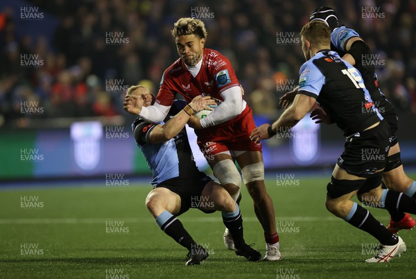 021223 - Cardiff Rugby v Scarlets - United Rugby Championship - Vaea Fifita of Scarlets is tackled by Tinus de Beer of Cardiff 