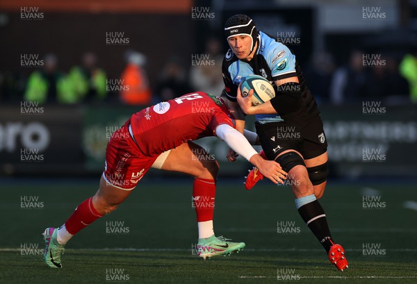 021223 - Cardiff Rugby v Scarlets - United Rugby Championship - Seb Davies of Cardiff is tackled by Eddie James of Scarlets 
