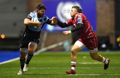 070123 - Cardiff v Scarlets - United Rugby Championship - Kirby Myhill of Cardiff is tackled by Steff Evans of Scarlets