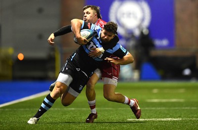 070123 - Cardiff v Scarlets - United Rugby Championship - Kirby Myhill of Cardiff is tackled by Steff Evans of Scarlets