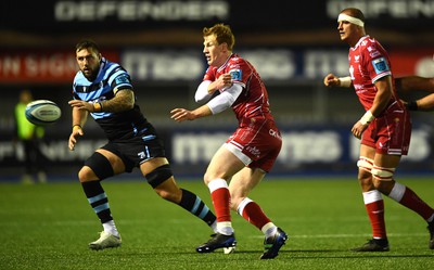 070123 - Cardiff v Scarlets - United Rugby Championship - Rhys Patchell of Scarlets gets the ball away